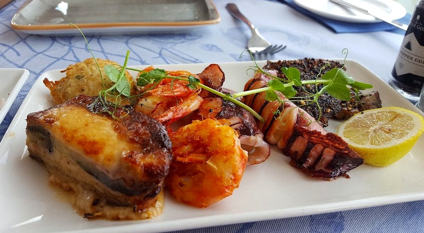 Grilled fish, prawns and octopus, plated at Arzella